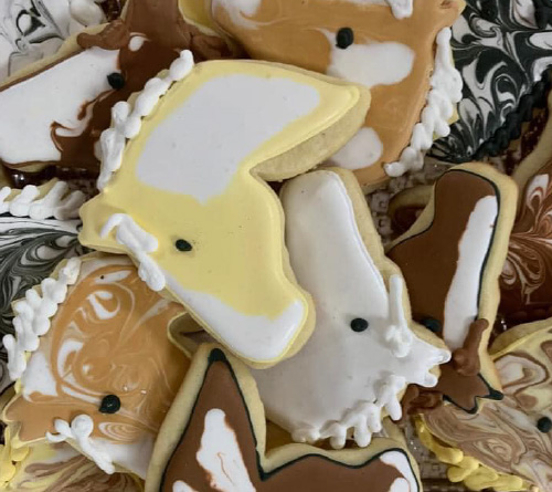 cookies in the shape of horses heads in different colors